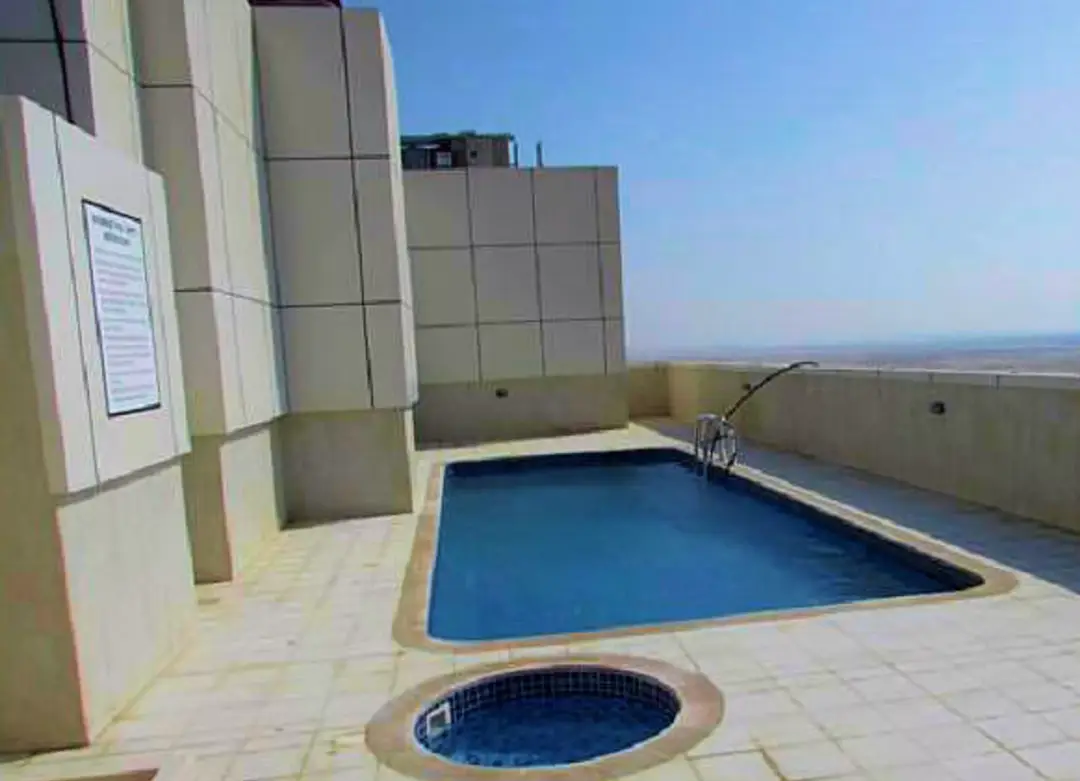 Al Sondos Residences 1 — Swimming Pools — Outdoor Swimming Pool — amenity | Profound Properties, Dubai